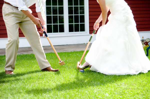 Bride and groom playing croquet on the back lawn at the Inn at Black Star Farms.