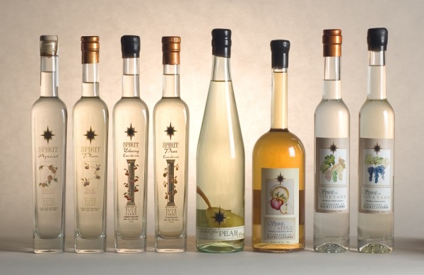 Bottle shots of our distilled spirits including fruit brandies and grappa.