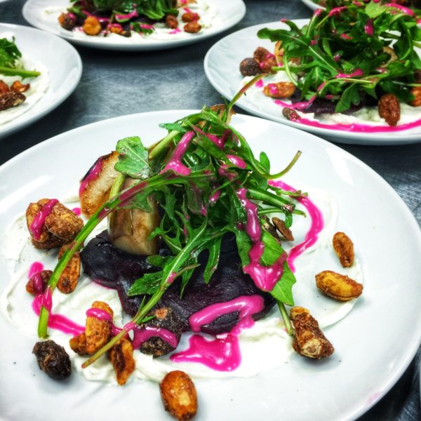 Beet salads with fresh greens and candied nuts.