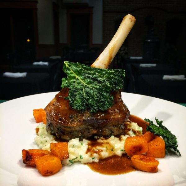Plate with a roasted lamb chop, mashed potatoes, and carrots from our weekend dinners at the Inn.
