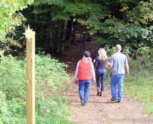 People hiking our trails at Black Star Farms Suttons Bay.
