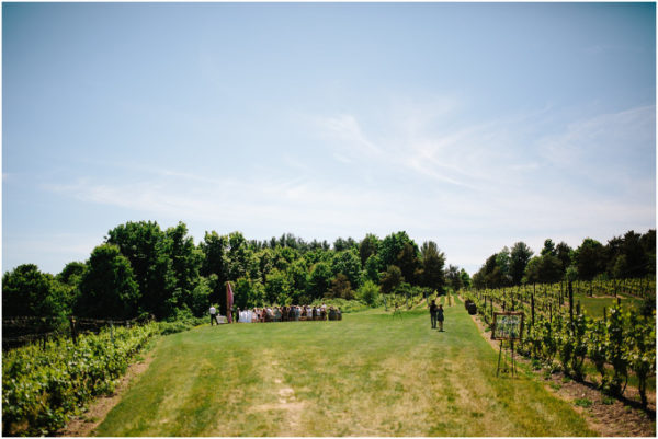 A far away view of the Scenic Hilltop Vineyard site with wedding happening.
