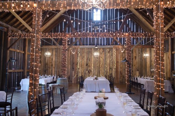 Wedding reception with decorated long tables in the Pegasus Barn.