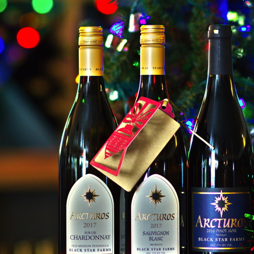 Three bottles of Black Star Farms wine with holiday flare.