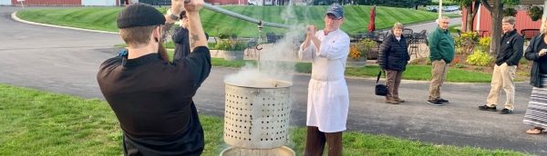 Removing the pot at the Great Lakes Fish Boil.