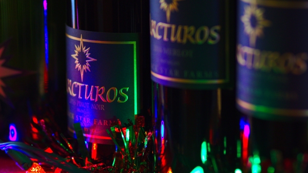 Red wine with holiday lights.