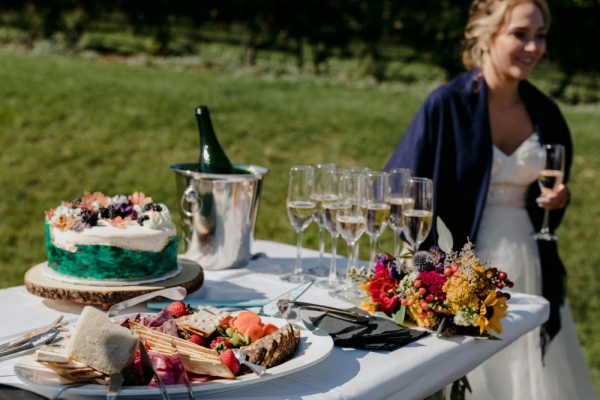 Table with food and wine for a small wedding.