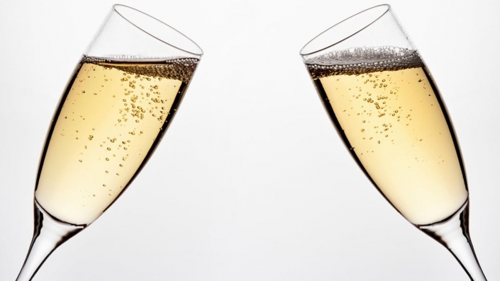 Two flutes with sparkling wine.