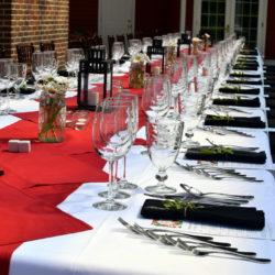 Table set for a wine dinner on the patio.