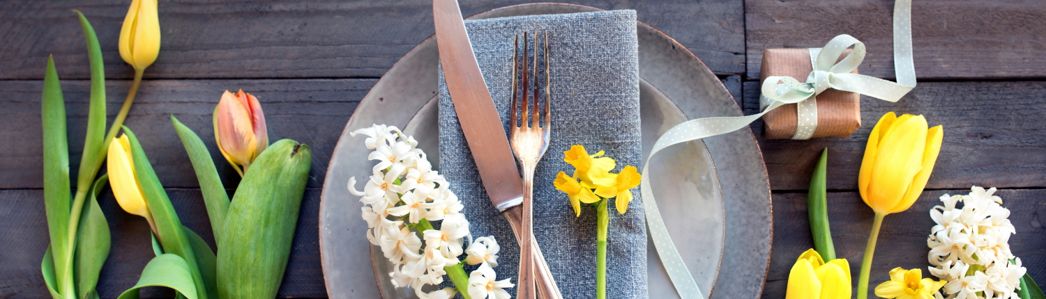 Mother's Day table setting with spring flowers.