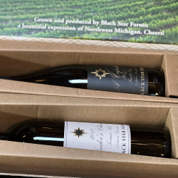 Two bottle of wine in a branded gift box.